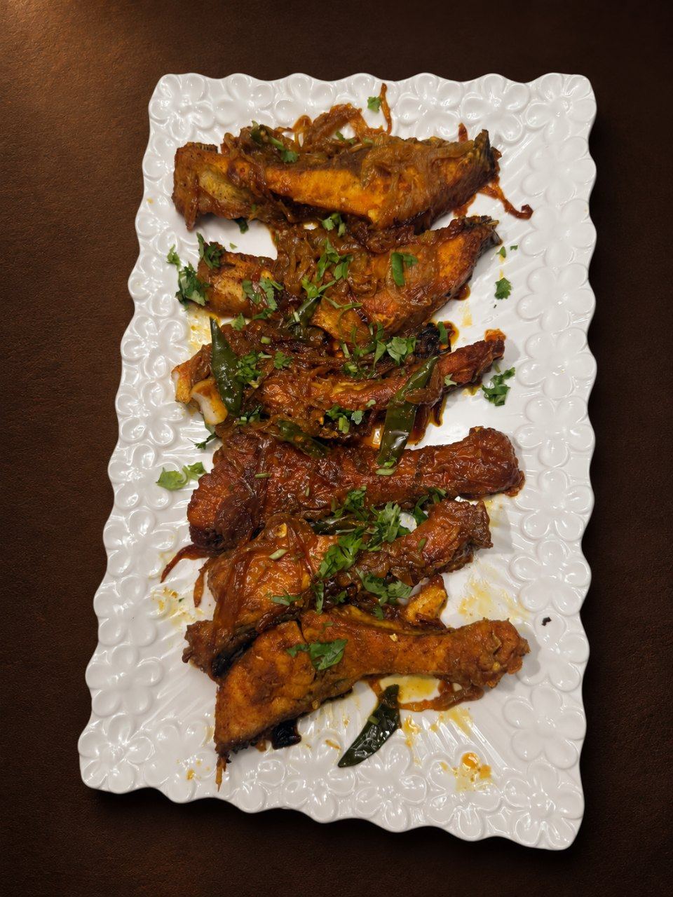 Fish curry on a white platter