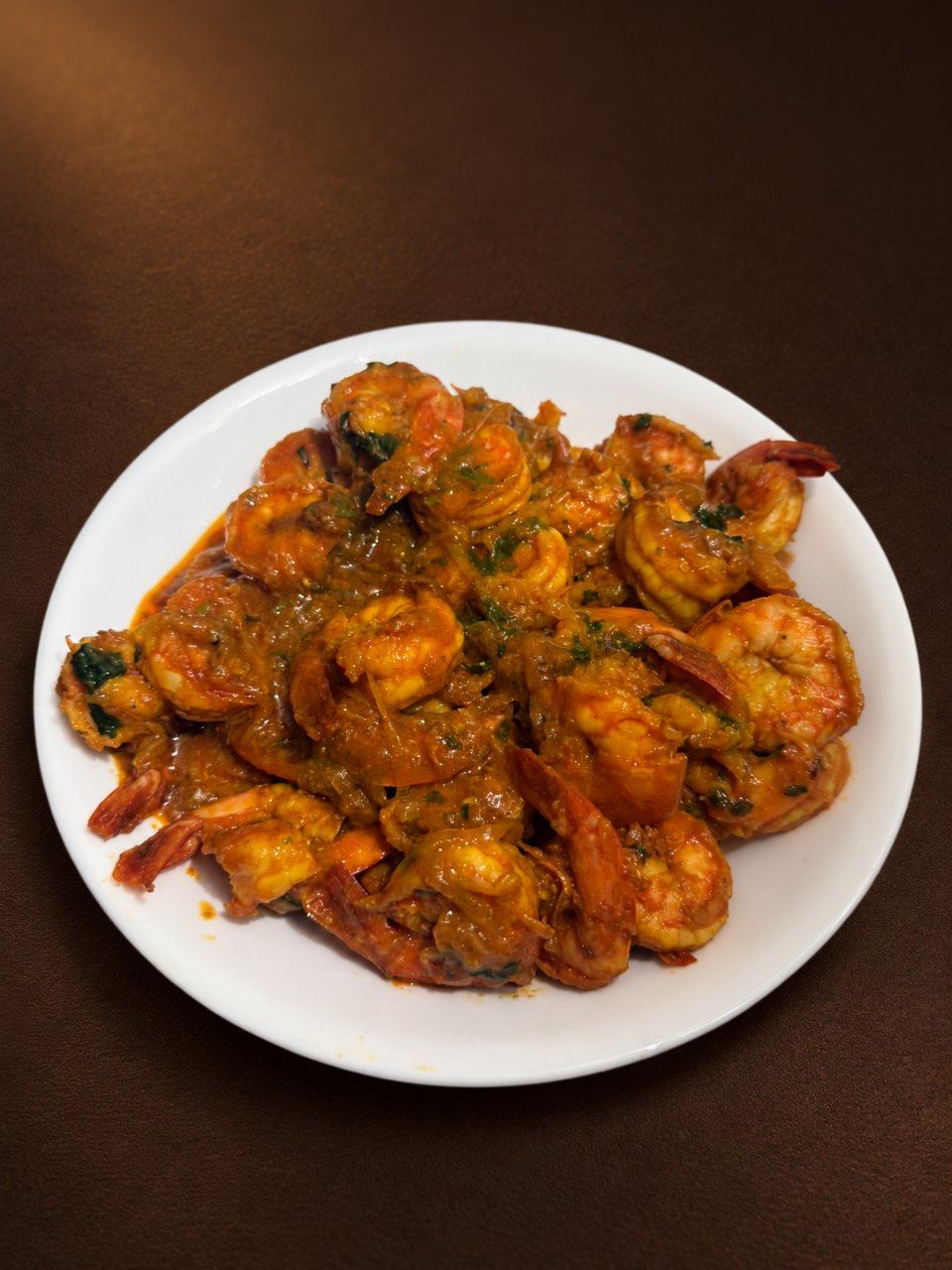 Shrimp curry on a white plate
